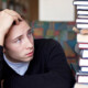"A college student holds their hand against their head as they stare at the tower of textbooks next to them. Substance abuse treatment in New York, NY can help you overcome procrastination due to drug use. Learn more about outpatient substance abuse treatment in New York, NY by contacting a substance abuse psychiatrist in New York, NY. 10022