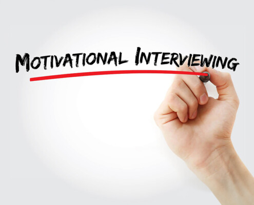 A hand writes and underlines the words Motivational Interviewing with a marker. Learn how addiction treatment in New York, NY can offer support from the comfort of home. Contact an addiction therapist in New York, NY to learn more about online addiction treatment in New York, NY today.