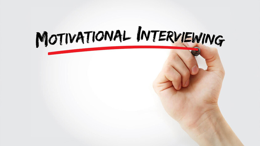 A hand writes and underlines the words Motivational Interviewing with a marker. Learn how addiction treatment in New York, NY can offer support from the comfort of home. Contact an addiction therapist in New York, NY to learn more about online addiction treatment in New York, NY today.