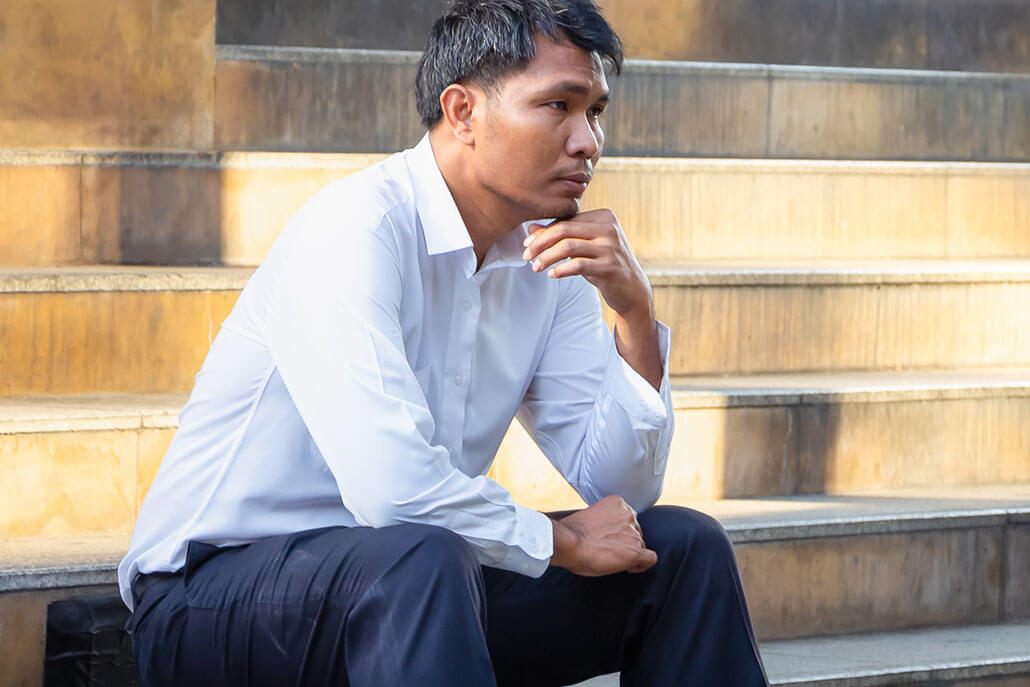 Contemplative man sits alone on concrete steps. This could represent anxiety brought on from an addition. Dual diagnosis treatment in New York, NY can offer support. Contact a dual diagnosis therapist to learn about co occurring disorder treatment in New York, NY and dual diagnosis treatment centers in New York, NY. 10022