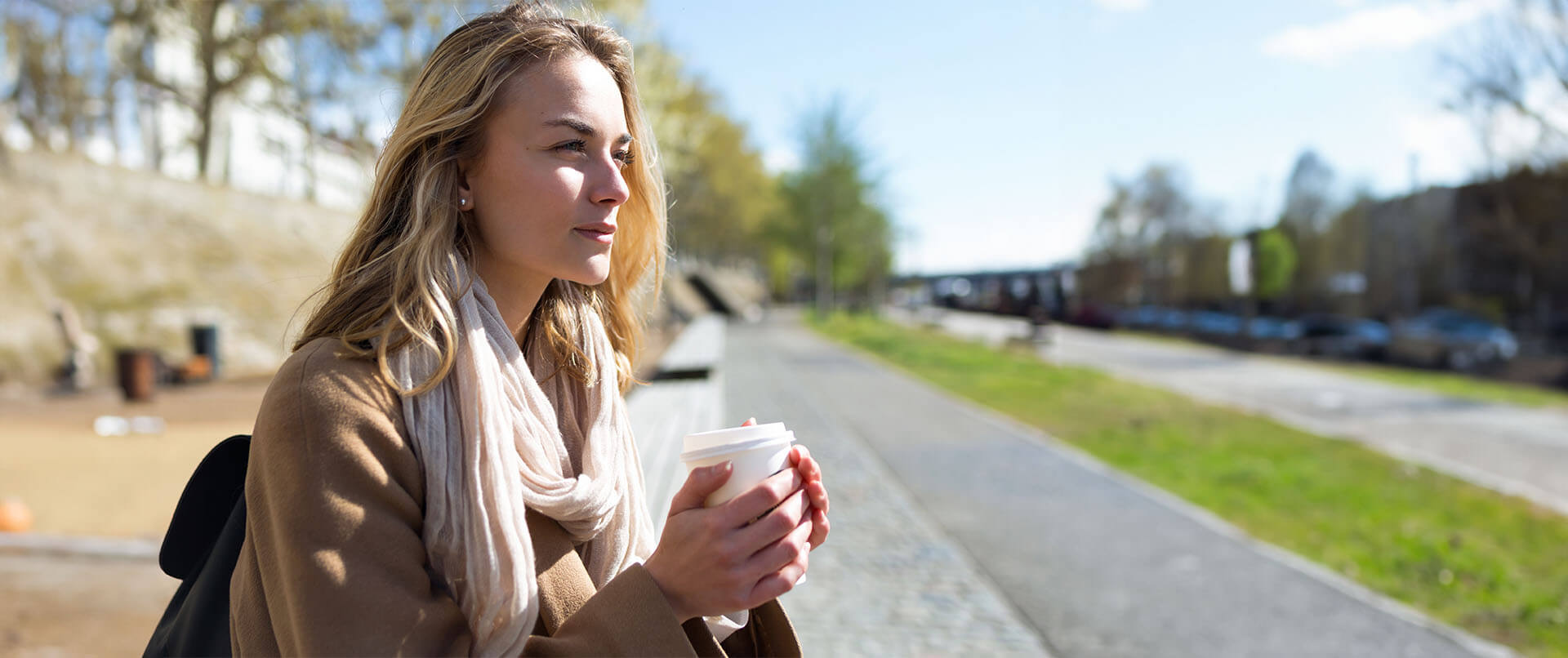 Contemplative woman sits on a sidewalk bench. Prescription drug addiction treatment in New York, NY can offer support. Contact a drug addiction therapist to learn more about narcotic addiction treatment in New York, NY. 10022