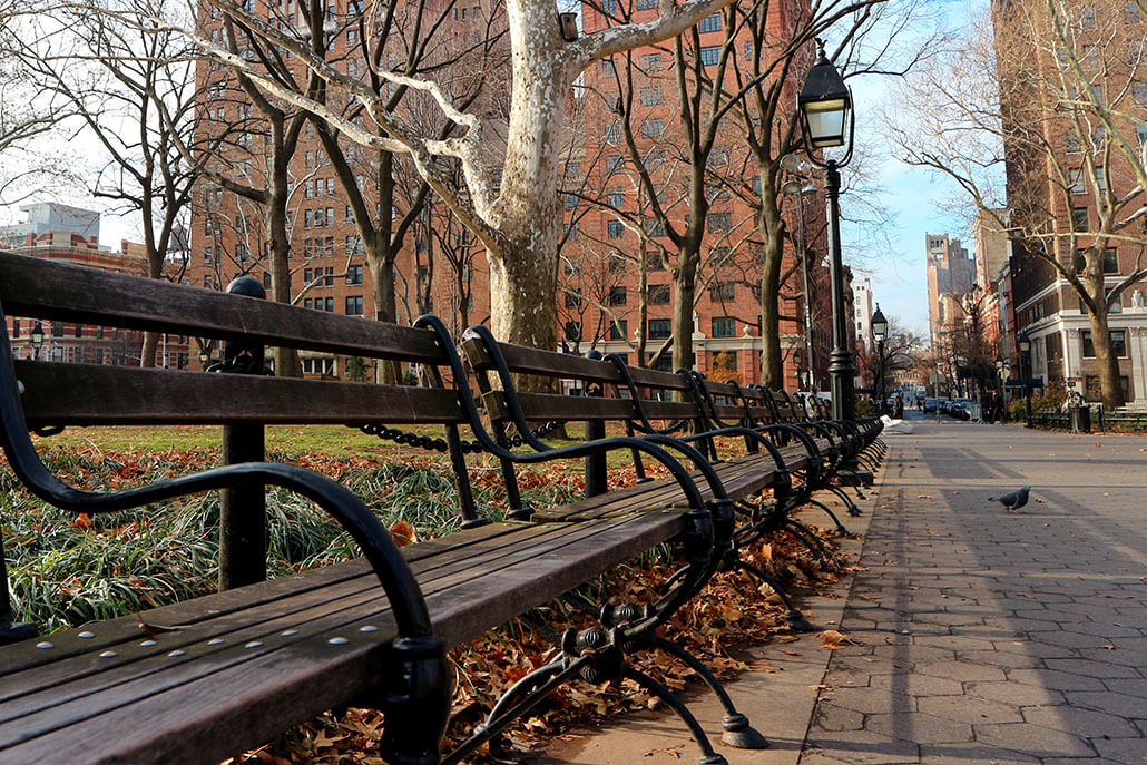 wood and iron benches lining a NYC, NY street in the fall | Addiction treatment in New York, NY can help you overcome cravings. Learn more from an addiction therapist in New York, NY today or contact an adult psychiatrist in New York, NY to learn more! 10022