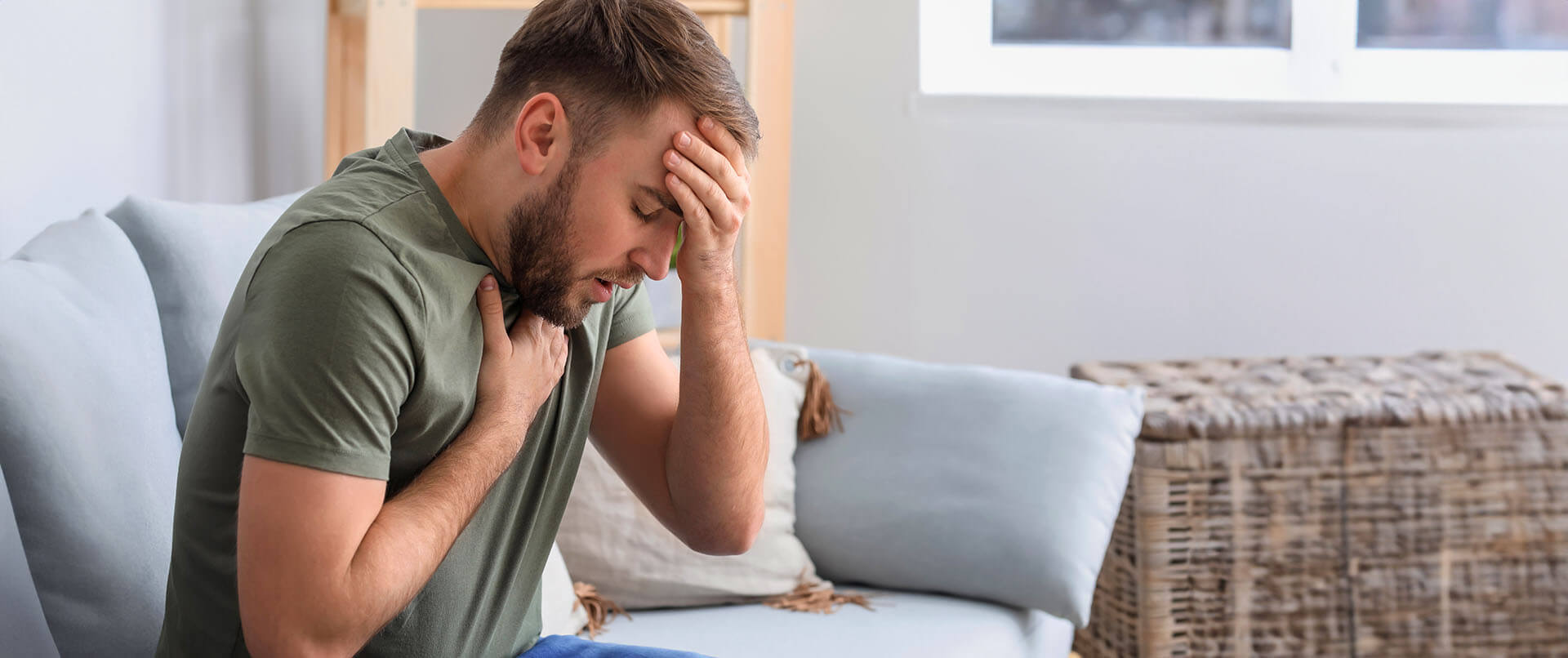 Distressed man having a panic attack. This could represent the trauma PTSD treatment in New York, NY can address. Learn more about PTSD treatment in NYC, Manhattan by contacting a PTSD therapist in New York, NY. 10022