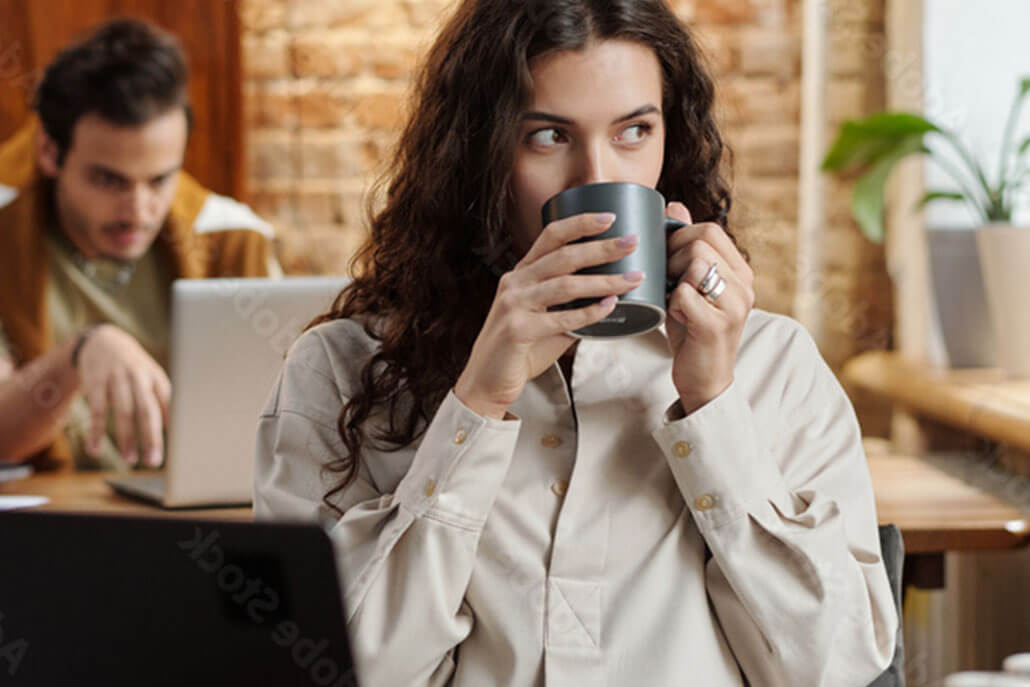 nervous young woman at cafe drinking coffee. This could represent the support PTSD treatment in New York, NY can offer. Learn more about PTSD treatment in NYC, Manhattan by searching