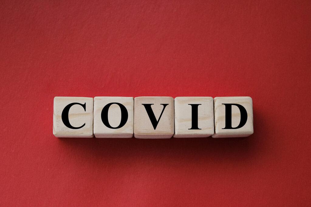 A close up of block letters that spell out COVID for Stephen Gilman. Learn how alcohol addiction help in New York, NY can support you from the comfort of home. Contact a psychiatrist in New York, NY to learn more about support for friends of alcoholics in NYC, Manhattan.