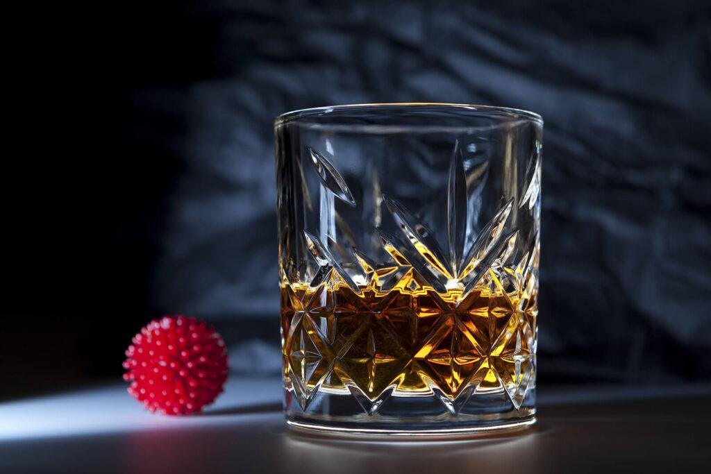 A close up of a shot glass with liquor. Learn more about the support alcohol addiction help in New York, NY can offer by contacting a psychiatrist in New York, NY today. They can offer alcohol treatment in New York, NY and other services.