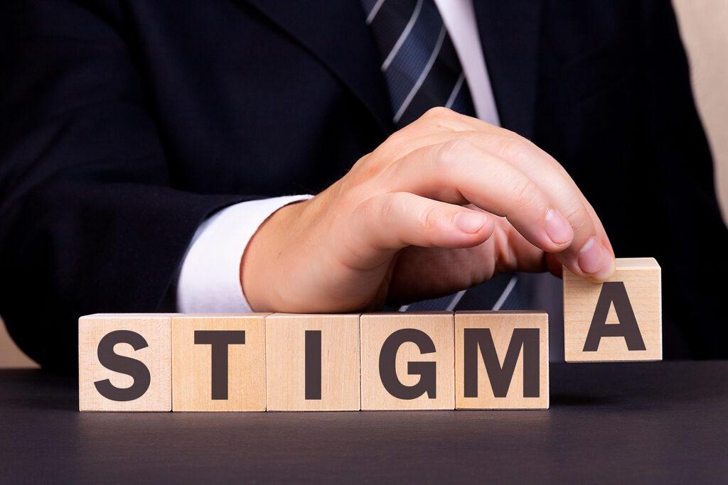 A close up of a person turning wooden blocks creating the the word stigma. Contact an addiction therapist in New York, NY to learn more about online addiction treatment in New York, NY and overcome the stigma around addiction. Contact a drug addiction therapist in New York, NY to learn more.

